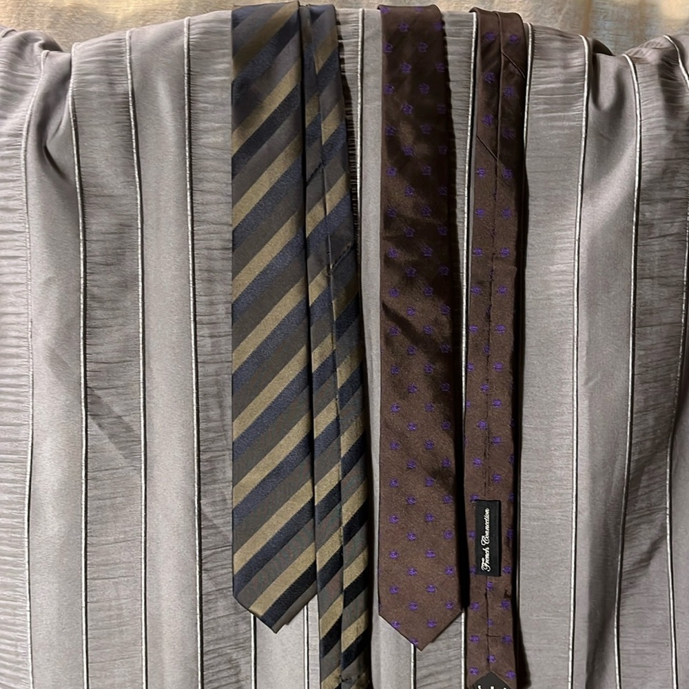 Two ties.  Pedro — striped polyester.  French Connection — brown silk.
